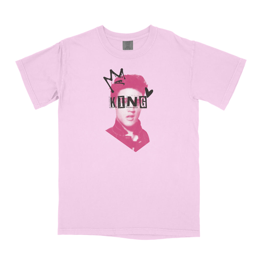 Pink t-shirt with graphic design of a man's head with a crown on it and 'KING' text over it on a white background